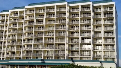 Front view of the towering Marco Apollo 1001 condo building, a symbol of luxury accommodations on Marco Island.