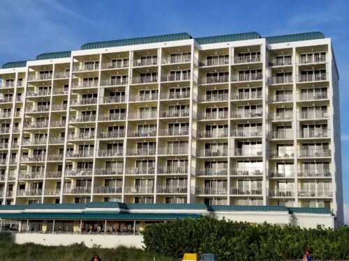 Front view of the towering Marco Apollo 1001 condo building, a symbol of luxury accommodations on Marco Island.