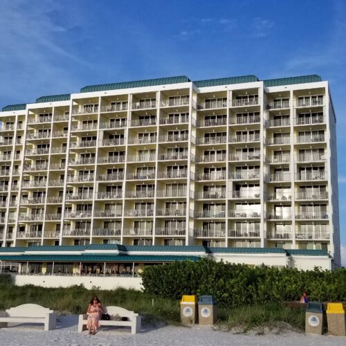 Front view of the towering Marco Apollo 1001 condo building, a symbol of luxury accommodations on Marco Island.